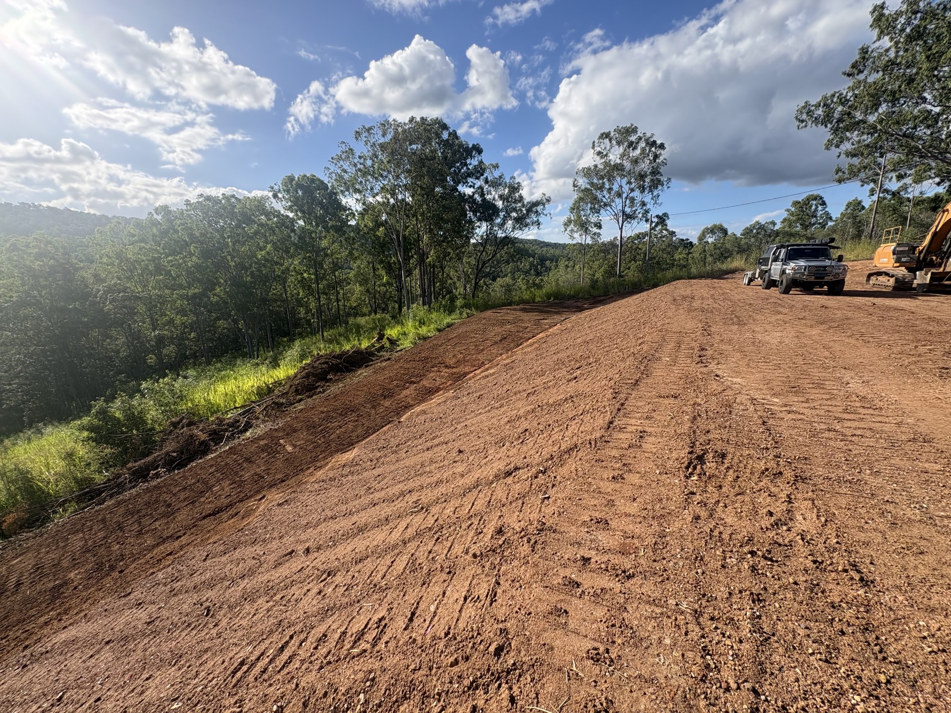 Level house pad cut into a slope with shaped batters at Glastonbury near Gympie