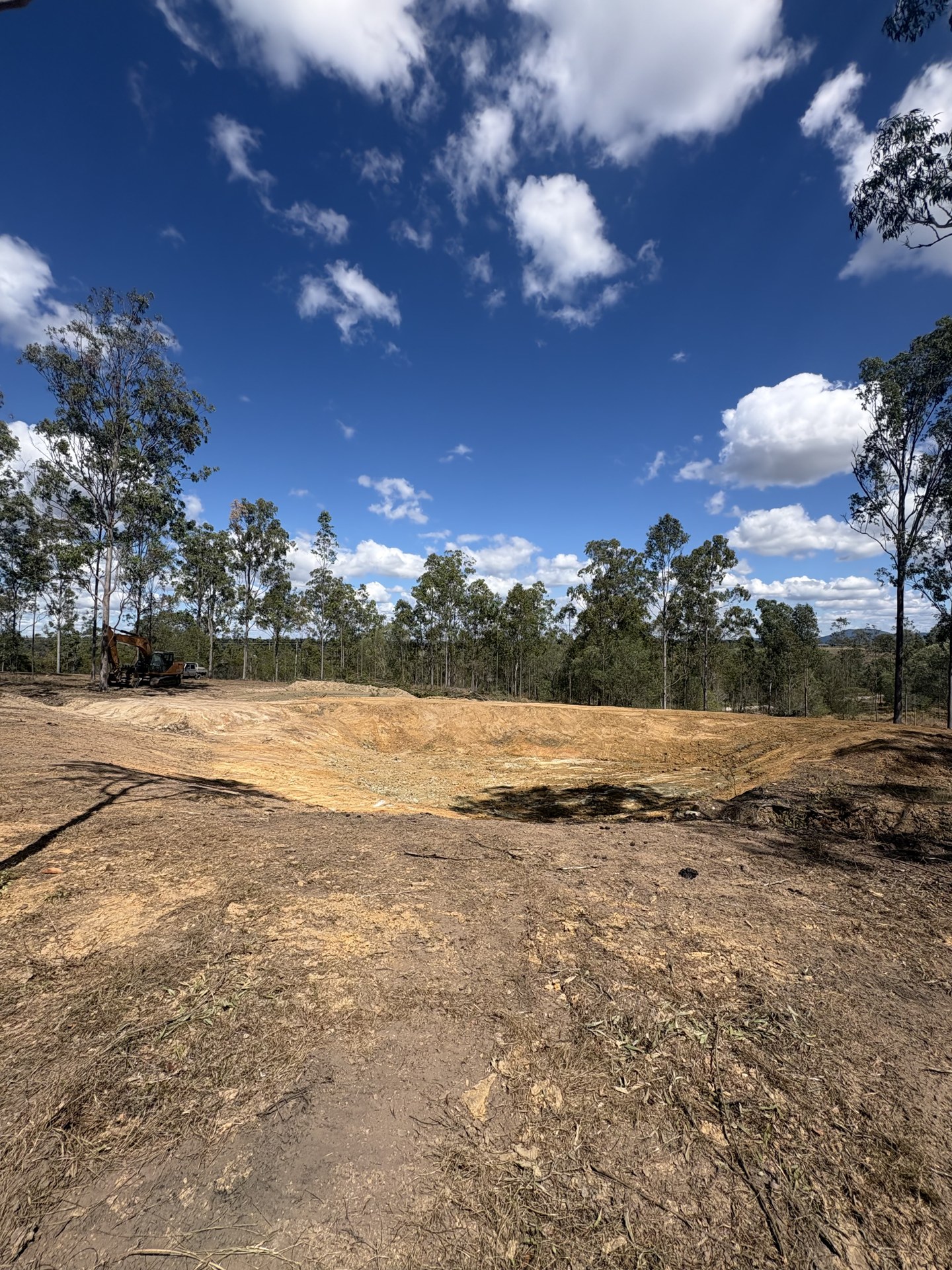 Rebuilt dam wall and clean dam basin after desilting works near Gympie QLD
