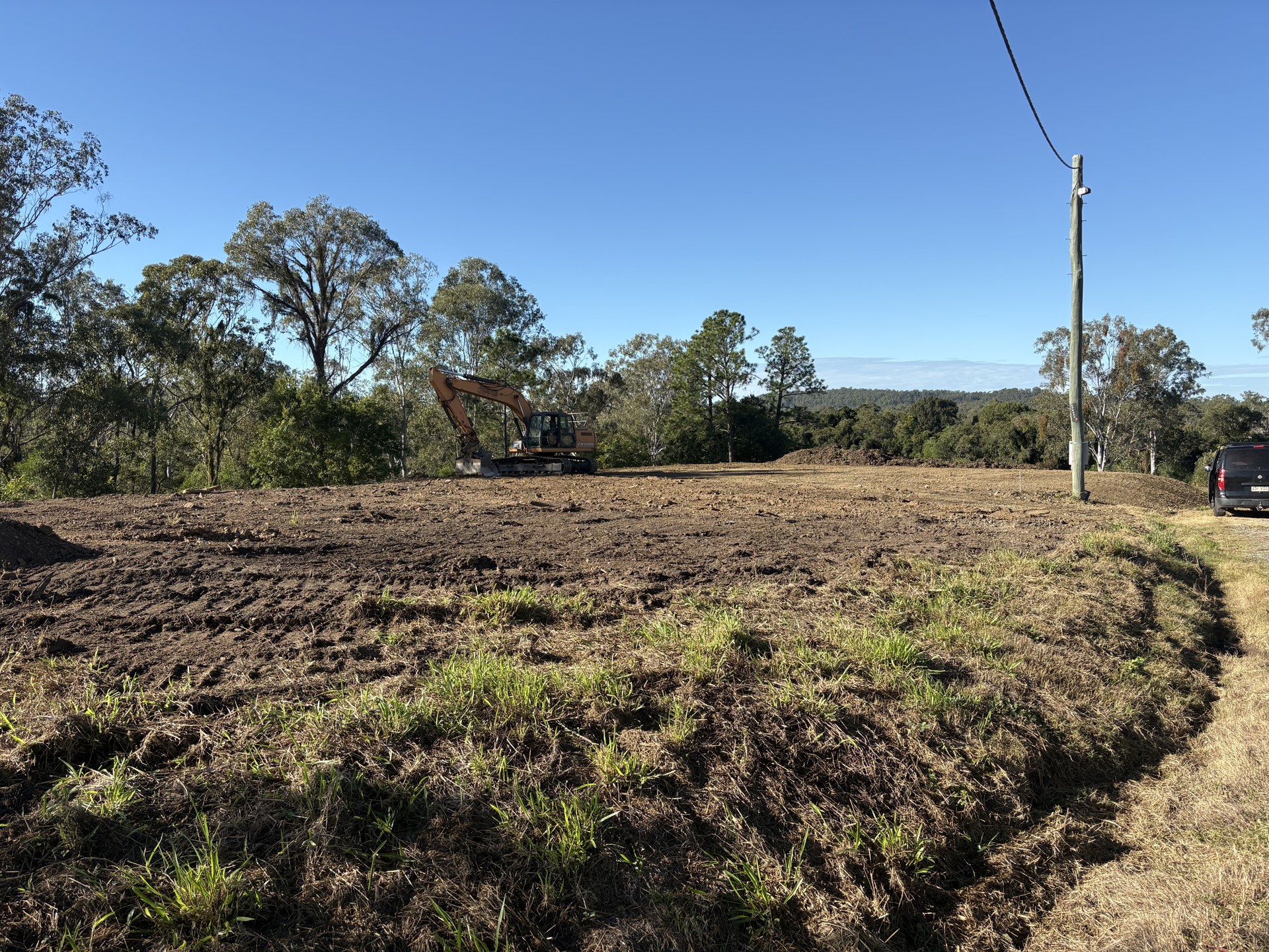 Finished site cut with cut batter and spoil placed on site at Mothar Mountain QLD