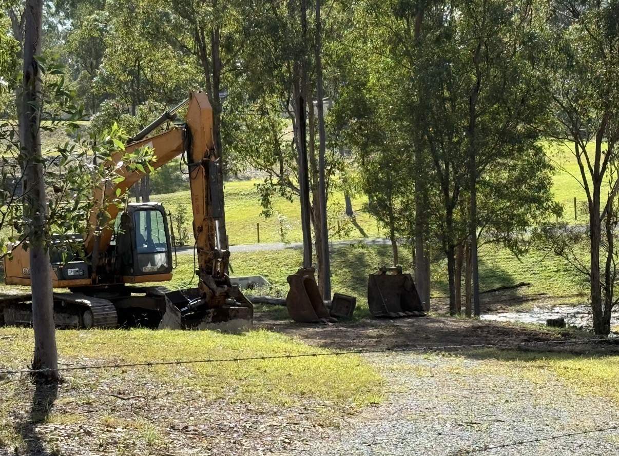21 tonne excavator with bucket attachments on a job site near Gympie QLD