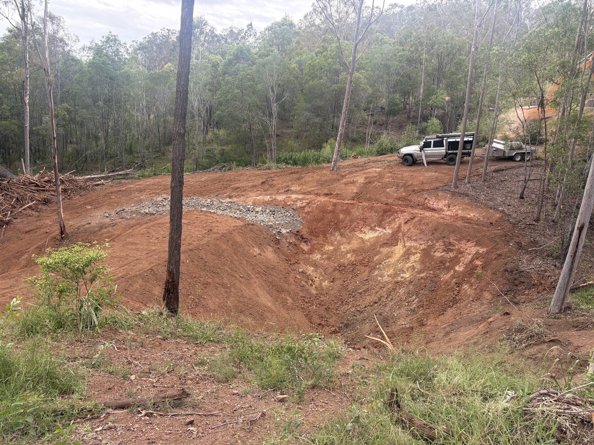 Newly built farm dam with shaped walls holding water on a Glastonbury property near Gympie