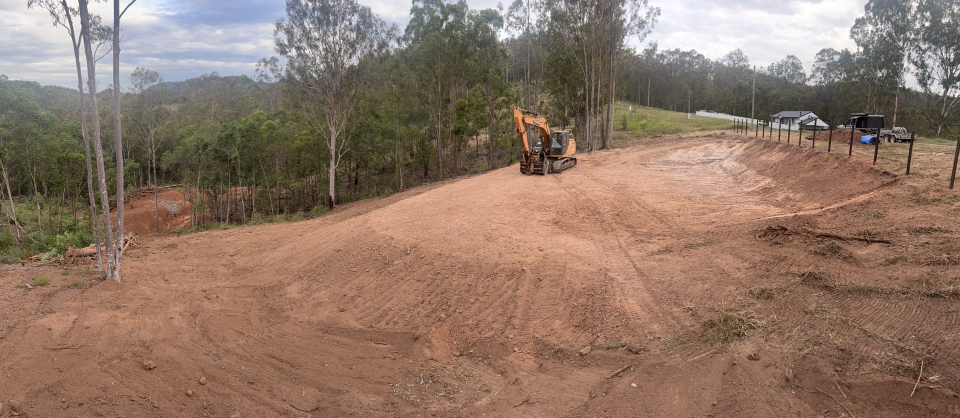 Freshly cut level building pad with shaped batters at Glastonbury near Gympie
