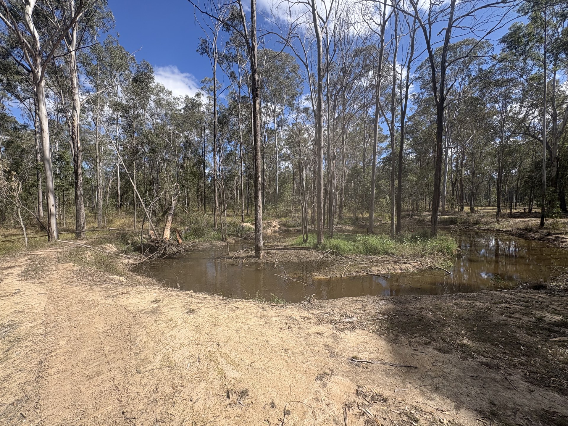 Eroded dam wall and washout on a rural property at Curra QLD
